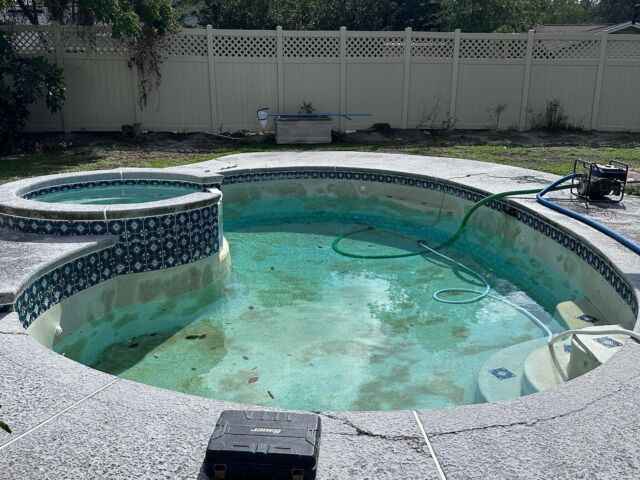 Full remodel. Remove glass block, install rebar and concrete new tile, new pool deck, and resurface pool interior with mini pebble pool finish #plastertechjax #pebblefinish #newtile #poolremodel